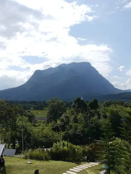 A limestone peak rising above fields